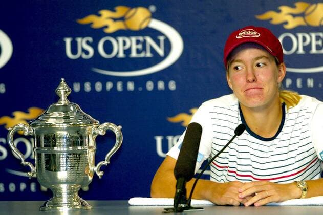 BRU231 - 20030907 - NEW YORK, USA : Justine Henin-Hardenne of Belgium looks at her trophy during a news conference after defeating Kim Clijsters to win the women s final at the 2003 US Open tennis championships, in Flushing Meadows, New York, Saturday 06 September 2003. Second seed Henin-Hardenne defeated world number one Clijsters 7-5, 6-1 to win her first US Open tennis title.  x1470124x