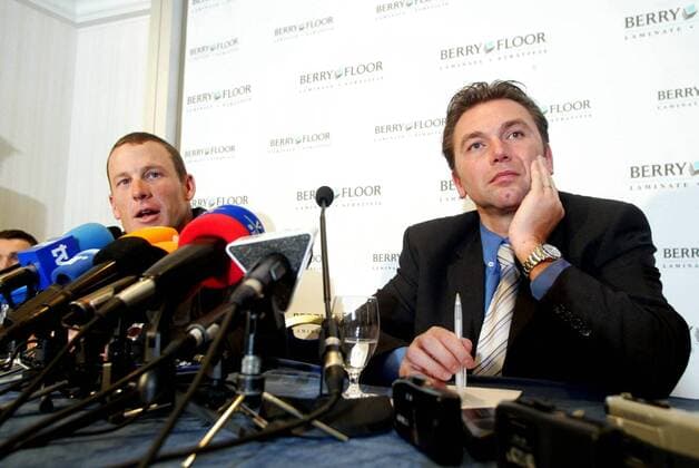 BRU58 - - BRUSSELS, BELGIUM : US cycling champion Lance Armstrong (L) gives a news conference with Belgian Johan Bruyneel (R), sports director of US Postal-Berry Floor, Friday 12 December 2003, in Brussels. JOHNxTHYS  x1470714x