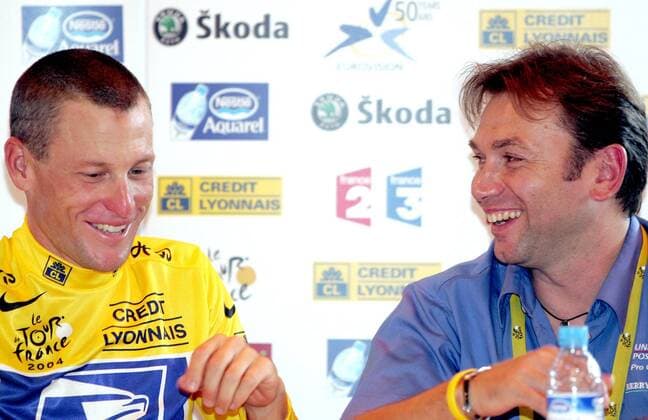 BRU39 - - BESANCON, FRANCE : US Lance Armstrong (L) laughs with his Belgian Sports Director Johan Bruyneel (R) during a news conference after winning the 19th stage of the Tour de France cycling race, Saturday 24 July 2004, in Besancon. The 19th stage is a 56km long individual time trial around Besancon. PHILIPPExBUISSIN  x2036297x