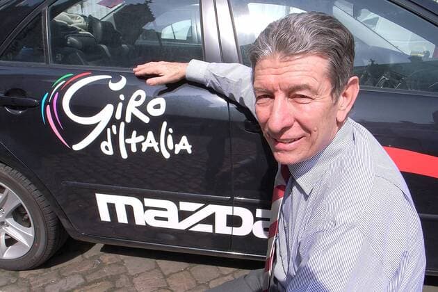 - LIEGE, BELGIUM: Former cycling world champion Felice Gimondi poses near a Giro car in Liege, Thursday 04 May 2006. The Giro cycling tour will start on Saturday 06 May 2006 in Liege. EricxLALMAND  x4266664x