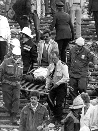 File photo dated 29 May 1985 of spectators leaving the stands of the Heysel Stadium in Brussels after violent clashes between Turin Juventus and Liverpool fans, which ended with a death toll of 39. (BW only) Belga dap  x475170x