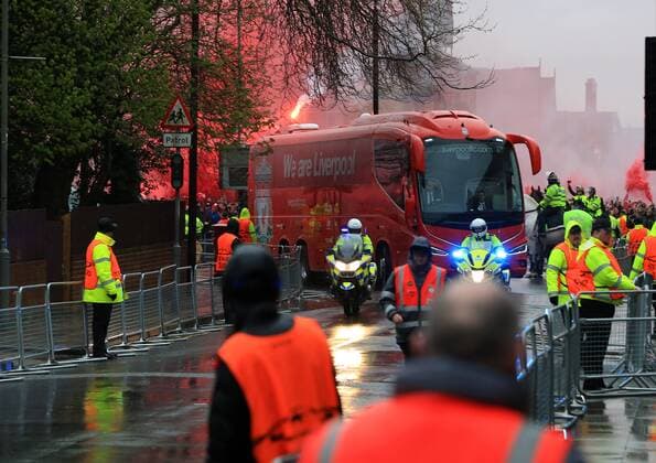 24th April 2018, Anfield, Liverpool, England; UEFA Champions League football, semi final, 1st leg, Liverpool versus AS Roma; the Liverpool team bus arrives in Anfield Road shrouded in smoke flares  ActionPlus12016806