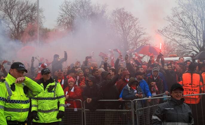 24th April 2018, Anfield, Liverpool, England; UEFA Champions League football, semi final, 1st leg, Liverpool versus AS Roma; Liverpool greet the arrival of the Liverpool team bus in Anfield Road with red smoke smoke flares  ActionPlus12016810