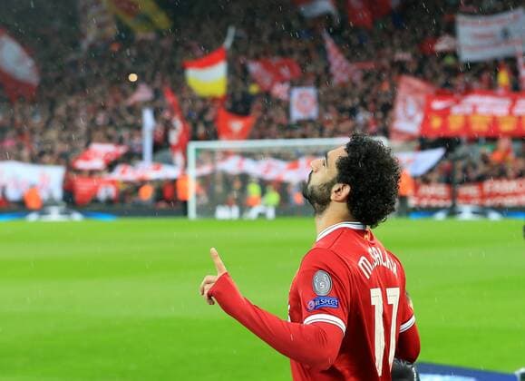 24th April 2018, Anfield, Liverpool, England; UEFA Champions League football, semi final, 1st leg, Liverpool versus AS Roma; Mohamed Salah of Liverpool says a prayer as he takes to the field in front of the Kop  ActionPlus12016818