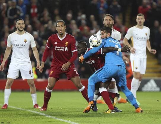 (180425) -- LIVERPOOL, April 25, 2018 -- Alisson Becker (Front, R), goalie of Roma vies with Liverpool s Sadio Mane during the UEFA Champions League Semi-finals 1st leg match between Liverpol FC and AS Roma at the Anfield Stadium in Liverpool, Britain on April 24, 2018. Liverpool won 5-2. )(wll) (SP)BRITAIN-LIVERPOOL-SOCCER-UEFA-CHAMPIONS LEAGUE-LIVERPOOL VS ROMA HanxYan 