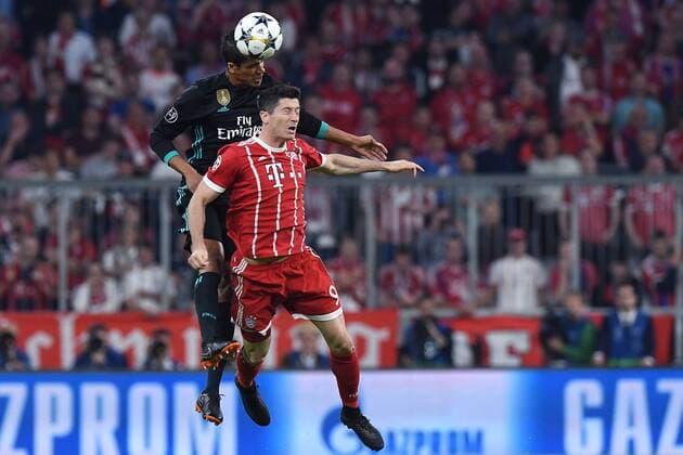 Football Champions League semi-finals FC Bayern Munich Real Madrid on 25 04 2018 in the Allianz Arena in Munich Raphael Varane Madrid behind Robert Lewandowski Munich front xRx