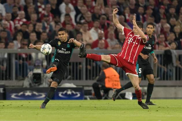 Munich Germany 25 04 2018 UEFA Champions League 2017 18 Season Semi Final Leg One Semifinals FC Bayern Munich Real Madrid Casemiro Real Madrid and Robert Lewandowski FCB in action DeFodi048