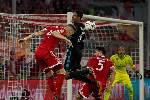 Munich Germany 25 04 2018 UEFA Champions League 2017 18 Season Semi Final Leg One Semifinals Bayern Munich Real Madrid Niklas Suele FCB Raphael Varane Real Madrid and Mats Hummels FCB in action DeFodi048