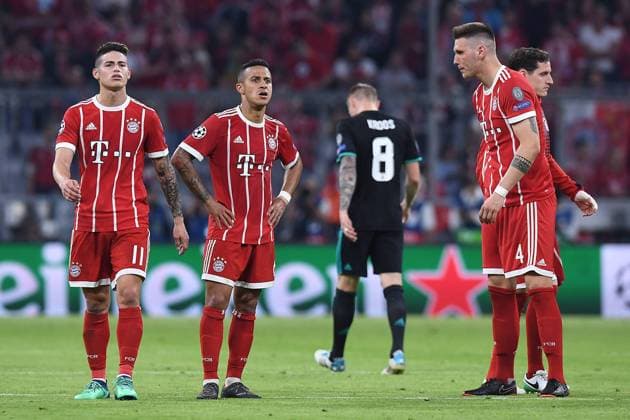 Football Champions League semi-finals FC Bayern München Real Madrid on 25 04 2018 in the Allianz Arena in Munich Disappointed Munich players after the game James Rodriguez Munich left Thiago Alcantara Munich center Niklas Süle Munich right xRx