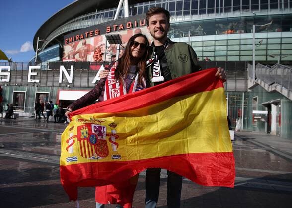 26th April 2018, Emirates Stadium, London, England; UEFA Europa League football, semi final, 1st leg, Arsenal versus Atletico Madrid; Group of Atletico Madrid fans pose with the flag of Spain outside Emirates Stadium kick off  ActionPlus12017157