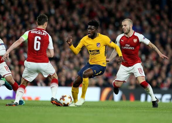 26th April 2018, Emirates Stadium, London, England; UEFA Europa League football, semi final, 1st leg, Arsenal versus Atletico Madrid; Jack Wilshere of Arsenal and Laurent Koscielny of Arsenal put pressure on Thomas Partey of Atletico Madrid  ActionPlus12017274