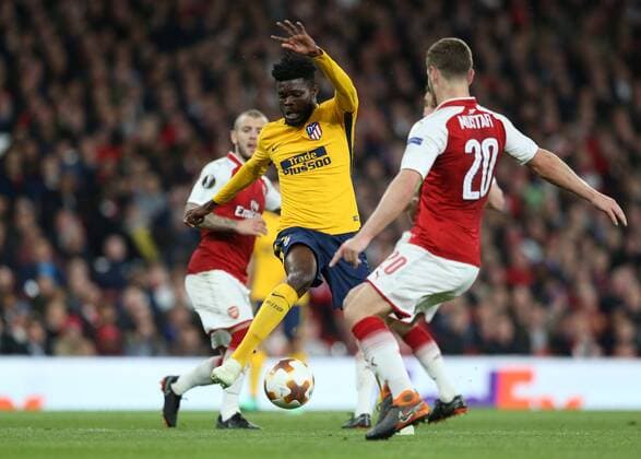 26th April 2018, Emirates Stadium, London, England; UEFA Europa League football, semi final, 1st leg, Arsenal versus Atletico Madrid; Shkodran Mustafi of Arsenal put pressure on Thomas Partey of Atletico Madrid  ActionPlus12017275