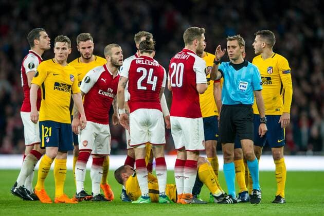 Match referee Clement Turpin (FRA) surrounded by players during the UEFA Europa League Semi Final match between Arsenal and Atletico Madrid at the Emirates Stadium, London, England on 26 April 2018. Copyright: xSalvioxCalabresex 19780022