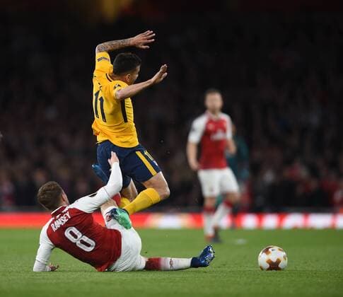 Arsenal v Atletico Madrid UEFA Europa League Semi-Final Arsenal s Aaron Ramsey tackles Atletico Madrid?s Angel Correa during the UEFA Europa League Semi-Final match at the Emirates Stadium, London Content Not Available For UK Newspapers Copyright: xDanielxHamburyx FIL-11704-0017