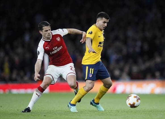 Arsenal s Granit Xhaka tussles with Atletico s Angel Correa during the Europa League Semi Final 1st Leg, match at the Emirates Stadium, London. Picture date: 26th April 2018. Picture credit should read: David Klein Sportimage EDITORIAL USE ONLY. No use with unauthorised audio, video, data, fixture lists, club league logos or live services. Online in-match use limited to 120 images, no video emulation. No use in betting, games or single club league player publications.