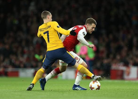 26th April 2018, Emirates Stadium, London, England; UEFA Europa League football, semi final, 1st leg, Arsenal versus Atletico Madrid; Antoine Griezmann of Atletico Madrid challenges Aaron Ramsey of Arsenal  ActionPlus12017314