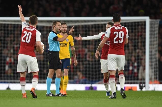 Arsenal v Atletico Madrid UEFA Europa League Semi-Final Arsenal players challenge referee Clement Turpin during the UEFA Europa League Semi-Final match at the Emirates Stadium, London Content Not Available For UK Newspapers Copyright: xDanielxHamburyx FIL-11704-0062