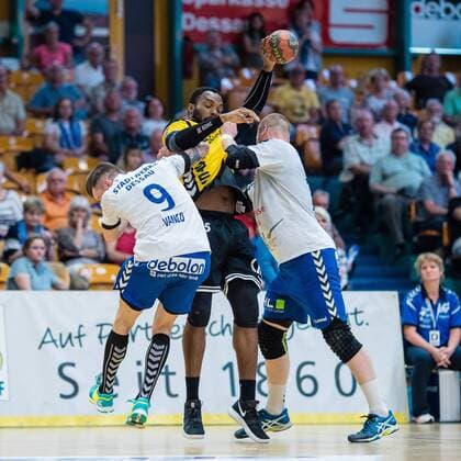 Yann Polydore 45 from HG Saarlouis on the ball with Marek Vranco 9 from Dessau Rosslauer HV 06 l and Libor Hanisch 17 from Dessau Rosslauer HV 06 r during the match at the DKB Handball 2 Bundesliga between Dessau Rosslauer HV 06 and HG Saarlouis in the Anhalt Arena am April 29 2018 in Bauhausstadt Dessau Saxony Anhalt Germany HB 2BL Dessau Rosslauer HV 06 HG Saarlouis Bauhausstadt Dessau Copyright: xEIBNER HartmutxBoesenerx EP_HBR