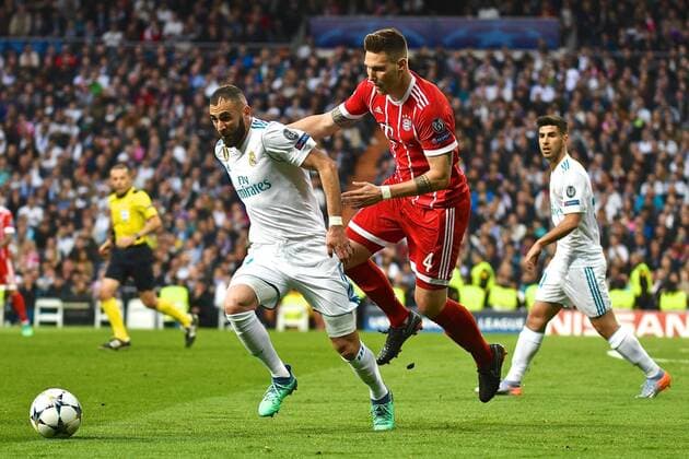 Real Madrid v Bayern Munich UEFA Champions League Semi-Final Karim Benzema of Real Madrid holds off Niklas S?le of FC Bayern Munich during the UEFA Champions League Semi-Final match at the Estadio Santiago Bernabeu, Madrid Content Not Available For UK Newspapers Copyright: xKristianxKanex FIL-11726-0027