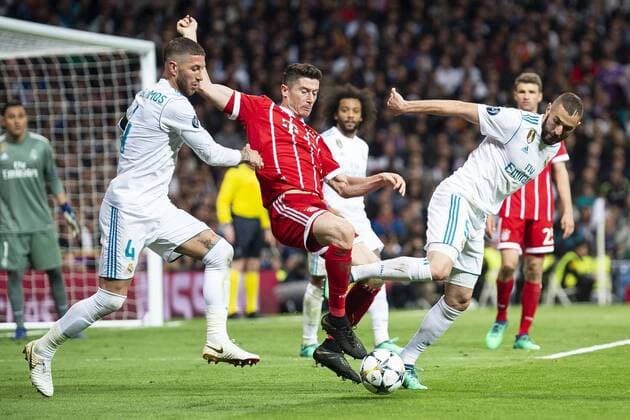 Real Madrid Sergio Ramos and Karim Benzema and Bayern Munich Thomas Muller during Semi Finals UEFA Champions League match between Real Madrid and Bayern Munich at Santiago Bernabeu Stadium in Madrid, Spain. May 01, 2018.  (20180501033)