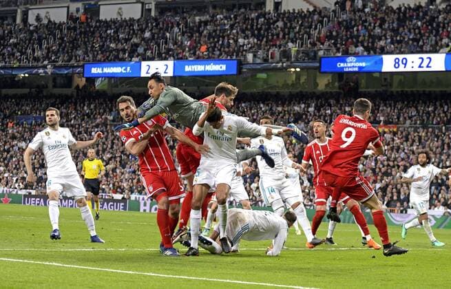 01 05 2018 Football UEFA Champions League 2017 2018 Semifinal Second leg Real Madrid FC Bayern Munich at Bernabeu Stadium Madrid center keeper Keylor Navas Real Madrid boxing the ball away V li Mats Hummels Bayern Munich Javi Martinez FC Bayern Munich Robert Lewandowski FC Bayern Munich