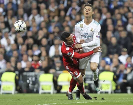 1st May 2018, Santiago Bernabeu, Madrid, Spain; UEFA Champions League football, semi final, 2nd leg, Real Madrid versus Bayern Munich; Thiago Alcantara (Bayern Munich) and Cristiano Ronaldo (Real Madrid) clash while challenging for the ball  ActionPlus12018828
