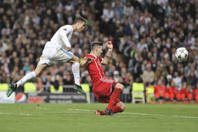 1st May 2018, Santiago Bernabeu, Madrid, Spain; UEFA Champions League football, semi final, 2nd leg, Real Madrid versus Bayern Munich; Niklas Sule (Bayern Munich) challenges as Cristiano Ronaldo (Real Madrid) gets his shot away  ActionPlus12018831