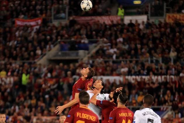 2nd May 2018, Stadio Olimpico, Rome, Italy; UEFA Champions League football, semi final, 2nd leg, AS Roma versus Liverpool; Virgil Van Dijk of Liverpool nudges Edin D& x17e;eko of Roma and his header goes backwards for Wijnaldum to score for Liverpool  ActionPlus12019060