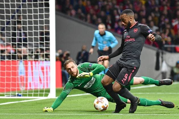 Atletico Madrid v Arsenal UEFA Europa League Semi-Final Atletico Madrid goalkeeper Jan Oblak saves at the feet of Alexandre Lacazette of Arsenal during the UEFA Europa League Semi-Final match at the Wanda Metropolitano Stadium, Madrid Content Not Available For UK Newspapers Copyright: xKristianxKanex FIL-11741-0053