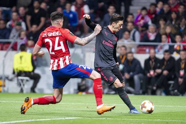 Atletico de Madrid Jose Maria Gimenez and Arsenal FC Mesut Ozil during Europa League Semi Finals First Leg match between Atletico de Madrid and Arsenal FC at Wanda Metropolitano in Madrid, Spain. May 03, 2018.  (20180503044)