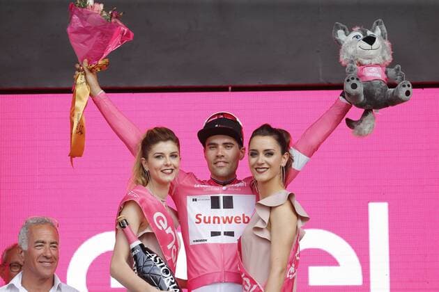 Dutch Tom Dumoulin of Team Sunweb celebrates on the podium in the pink leader s jersey after winning the first stage of the 101st edition of the Giro D Italia cycling tour, an individual time trial (9,7km) in Jerusalem, Israel, Friday 04 May 2018. FRANCE OUT YUZURUxSUNADA  x05339915x