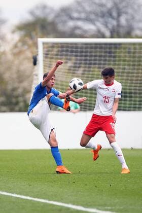 4th May, St Georges Park, Burton-on-Trent, England; UEFA Under 17 European Championships, Italy U17s versus Switzerland U17s; Alessio Riccardi of Italy controls the ball under pressure from Filip Frei of Switzerland  ActionPlus12019472