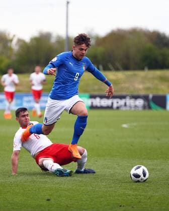 4th May, St Georges Park, Burton-on-Trent, England; UEFA Under 17 European Championships, Italy U17s versus Switzerland U17s; Edoardo Vergani of Italy jumps over the attempted challenge from Drilon Kastrati of Switzerland  ActionPlus12019486