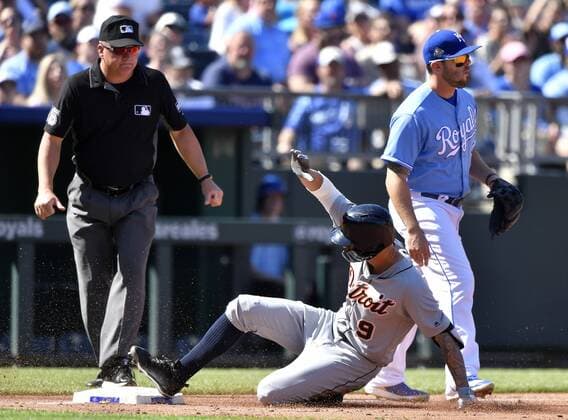 May 5, 2018 - Kansas City, MO, USA - The Detroit Tigers Nicholas Castellanos reaches third on a triple in front of Kansas City Royals third baseman Mike Moustakas in the third inning on Saturday, May 5, 2018, at Kauffman Stadium in Kansas City, Mo. Detroit at Kansas City - ZUMAm67_ 20180505_zaf_m67_035 Copyright: xJohnxSleezerx