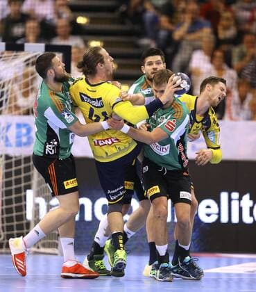 on the ball Kim Ekdahl du Rietz Löwen against Ilija Brozovic and Fabian Böhm Handball Final Four Tournament in Hamburg on Sun 06 05 2018 Final Rhein Neckar Löwen Burgdorf Hannover 30 26