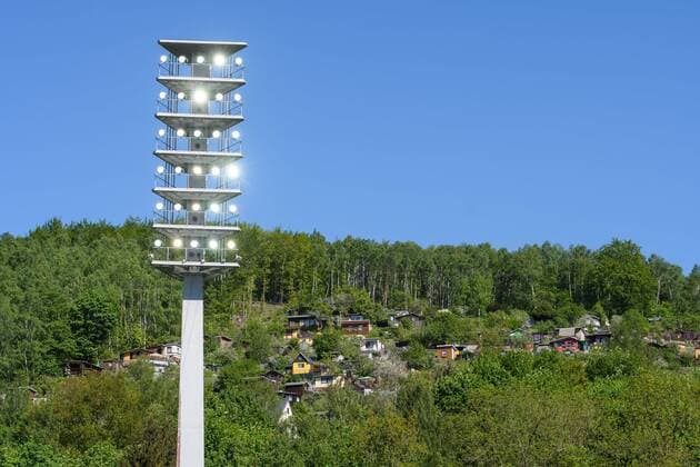 Floodlight of the Erzgebirgsstadion in the background Bungalows and allotments on a nearby hill SG Dynamo Dresden FC Erzgebirge Aue Football 2 League Season 2017 2018 33 Game day Erzgebirgsstadion Aue 06 May 2018