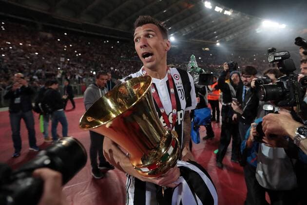 9th May 2018, Stadio Olimpico, Rome, Italy; Coppa Italia Football Cup final, Juventus versus AC Milan; Mario Mandzukic of Juventus celebrates with trophy after defeating AC Milan 4-0  ActionPlus12022843