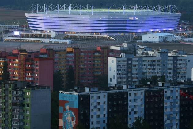KALININGRAD, RUSSIA - MAY 12, 2018: Blocks of flats with Kaliningrad Stadium behind; the stadium is one of the venues of the forthcoming FIFA World Cup WM Weltmeisterschaft Fussball Russia 2018. Peter Kovalev TASS  TS07F366
