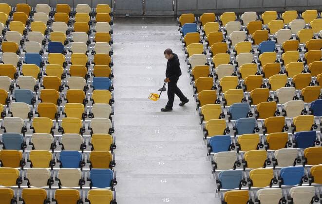 May 14, 2018 - Kiev, Ukraine - A worker cleans the Olimpiyskiy stadium, venue of the UEFA Champions League Final 2018, in Kiev, Ukraine. Kiev will host the final match of the UEFA Champions League Final 2018 on 26 May 2018. Soccer 2018: UEFA Champions League Final - ZUMAg194 20180514_zap_g194_019 Copyright: xSergxGlovnyx
