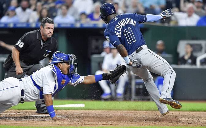 May 14, 2018 - Kansas City, MO, USA - Kansas City Royals catcher Salvador Perez couldn t tag Tampa Bay Rays Adeiny Hechavarria at the plate on an RBI single by Matt Duffy in the sixth inning during Monday s baseball game on May 14, 2018, at Kauffman Stadium in Kansas City, Mo. Royals vs Rays - ZUMAm67_ 20180514_zaf_m67_032 Copyright: xJohnxSleezerx