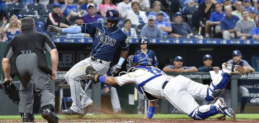 May 14, 2018 - Kansas City, MO, USA - Kansas City Royals catcher Salvador Perez couldn t tag Tampa Bay Rays Adeiny Hechavarria at the plate on an RBI single by Matt Duffy in the sixth inning during Monday s baseball game on May 14, 2018, at Kauffman Stadium in Kansas City, Mo. Royals vs Rays - ZUMAm67_ 20180514_zaf_m67_039 Copyright: xJohnxSleezerx