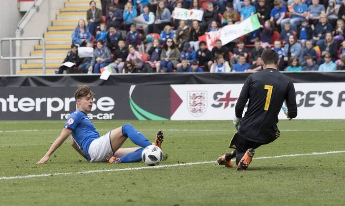 Edoardo Vergani of Italy strikes the ball at Nick Shinton (right) of Belgium during the UEFA European U17 U 17 Championship Semi Final match at the New York Stadium, Rotherham. Picture date 17th May 2018. Picture credit should read: James Wilson Sportimage EDITORIAL USE ONLY. No use with unauthorised audio, video, data, fixture lists, club league logos or live services. Online in-match use limited to 120 images, no video emulation. No use in betting, games or single club league player publications.