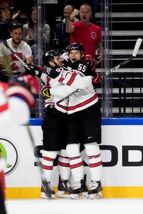180517 Canadas Connor McDavid and Marshal Darcy Kuemper cheer for 0 1 during the quarterfinals of the ice hockey World Cup between Russia and Canada on May 17, 2018 in Copenhagen  Copyright: PETTERxARVIDSON BB180517PA002