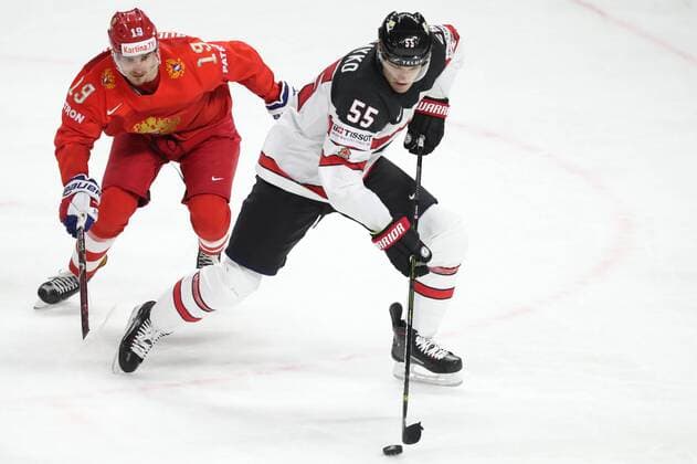 COPENHAGEN, DENMARK - MAY 17, 2018: Russia s Pavel Buchnevich (L) and Canada s Colton Parayko fight for the puck in their 2018 IIHF Ice hockey Eishockey World Championship WM Weltmeisterschaft Quarterfinal match at Royal Arena. Anton Novoderezhkin TASS  TS07FE05