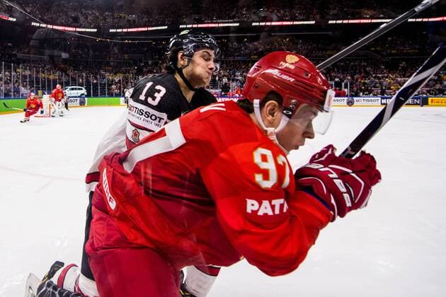 180517 Canadas Matt Barzal tackles Russias Nikita Gusev during the quarterfinals of the ice hockey World Cup between Russia and Canada on May 17, 2018 in Copenhagen  Copyright: PETTERxARVIDSON BB180517PA018