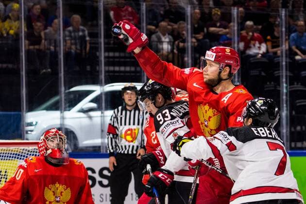 180517 Russias Sergei Andronov stretches for the puck in battle with Canadas Ryan Nugent Hopkins during the quarterfinals of the ice hockey World Cup between Russia and Canada on May 17, 2018 in Copenhagen  Copyright: PETTERxARVIDSON BB180517PA023