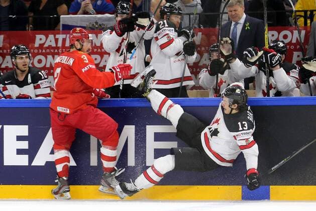 COPENHAGEN, DENMARK - MAY 17, 2018: Russia s Dinar Khafizullin and Canada s Matt Barzal (L-R front) fight for the puck in their 2018 IIHF Ice hockey Eishockey World Championship WM Weltmeisterschaft Quarterfinal match at Royal Arena. Alexander Demianchuk TASS  TS07FE17
