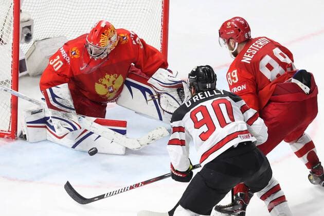 COPENHAGEN, DENMARK - MAY 17, 2018: Russia s goalie Igor Shestyorkin (L), Nikita Nesterov (R), and Canada s Ryan O Reilly (C) in action in their 2018 IIHF Ice hockey Eishockey World Championship WM Weltmeisterschaft Quarterfinal match at Royal Arena. Anton Novoderezhkin TASS  TS07FE74