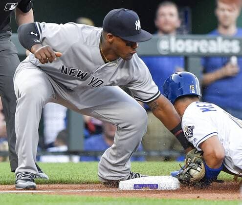 May 18, 2018 - Kansas City, MO, USA - Kansas City Royals Whit Merrifield steals third before the tag from New York Yankees third baseman Miguel Andujar in the first inning during Friday s baseball game on May 18, 2018, at Kauffman Stadium in Kansas City, Mo. Royals vs Yankees - ZUMAm67_ 20180518_zaf_m67_018 Copyright: xJohnxSleezerx