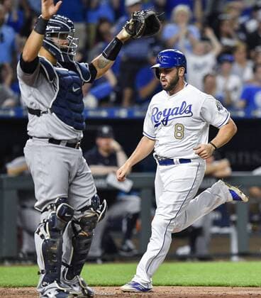 May 18, 2018 - Kansas City, MO, USA - Kansas City Royals Mike Moustakas scores in front of New York Yankees catcher Gary Sanchez on a double by Salvador Perez in the seventh inning during Friday s baseball game on May 18, 2018, at Kauffman Stadium in Kansas City, Mo. Royals vs Yankees - ZUMAm67_ 20180518_zaf_m67_057 Copyright: xJohnxSleezerx